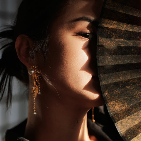 Model wearing the DONGXI Collection by COXIVIVIAMO, showcasing elegant demi-fine jewelry pieces blending Eastern and Western influences.